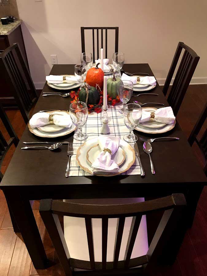 Full view of table with fall decor and china